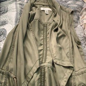 green vest with sowed in pockets.